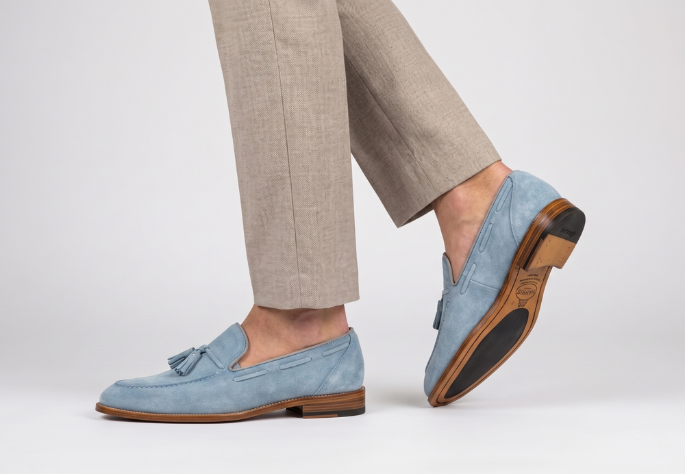 Suede moccasin with pom pom